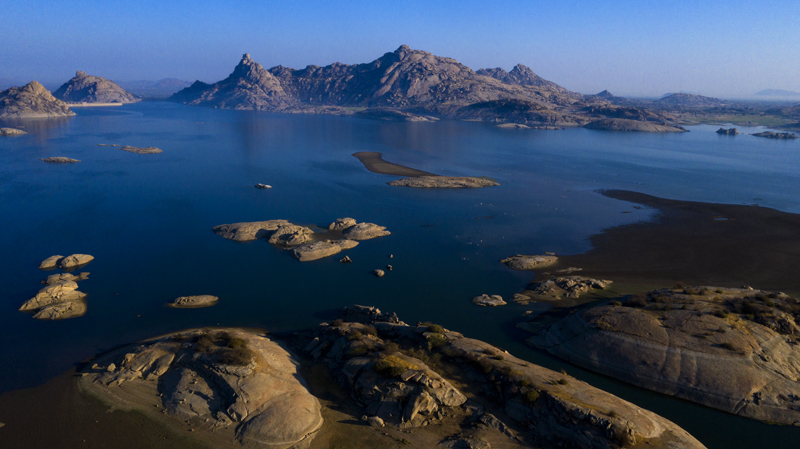 <img src="bera jawai dam.jpeg" alt="offbeat stay in caravan campervan camp on the move nomadic with all comforts of camping family holidays romantic vacation for couples in wilderness rajasthan">