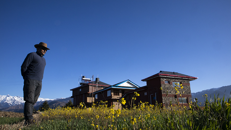 guest enjoying a walk on offbeat nomadic holiday for families couples outdoor experience camp to relax colonel's highland retreat & astrocamp valley in himachal pradesh.