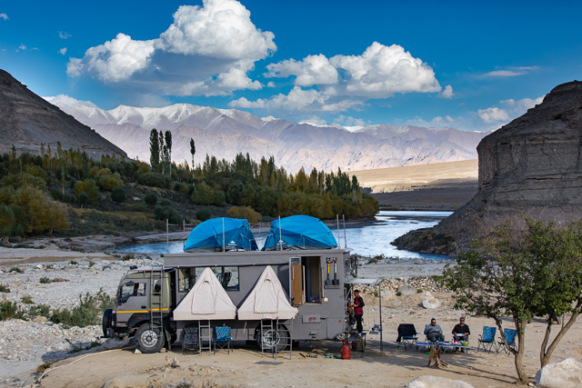 <img src="overland truck caravan camp riverbank ladakh.jpeg" alt="taurus overlanding caravan mobile camp on the riverbed offers best offbeat family holidays, romantic vacations, secluded exclusive location away from tourists india">