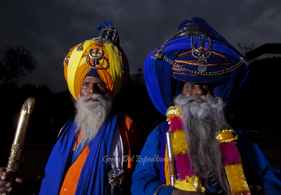 nihang sikh warriors wearing traditional dress with very big turban.