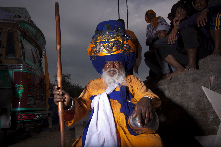 old man of nihang sikh soldiers wearing big turban.