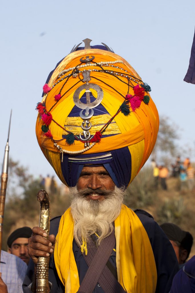 big turban nihang sikh at anadpur sahab during hola mohalla in punjab.