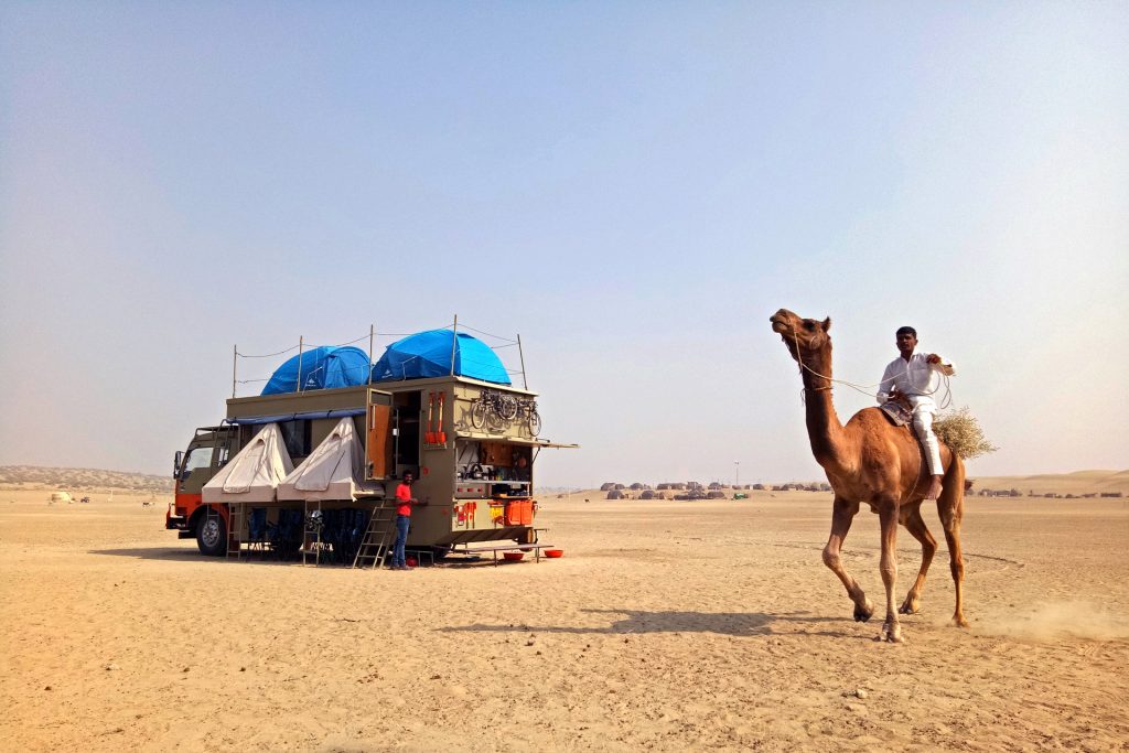 <img src="caravan campervan camping RV.jpeg" alt="caravan camel ride safari thar desert pristine virgin sand dunes with all comforts of camp hosted by campervan camp RV motorhome nomadic overlanding border family holidays romantic offbeat vacation for couples jaisalmer rajasthan India">