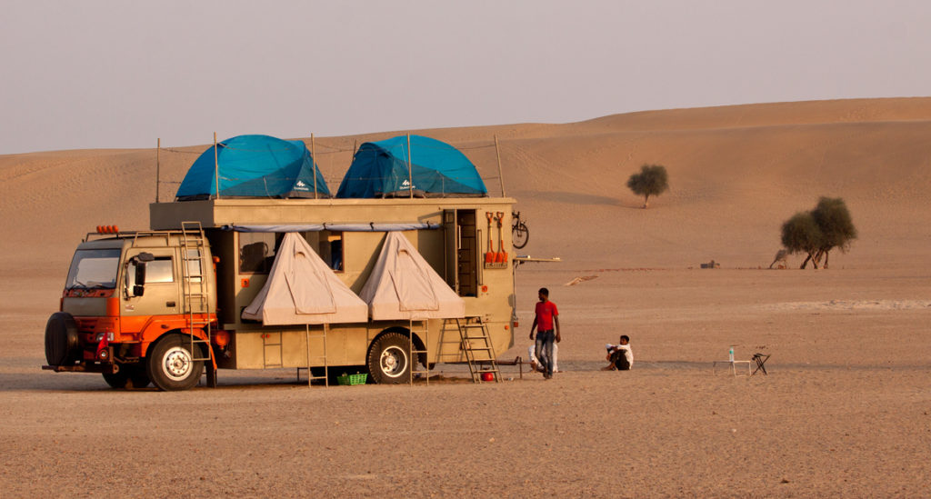 <img src="caravan holidays in desert as motorhome.jpeg" alt="caravan campervan motorhome thar desert pristine virgin sand dunes with all amenities of luxury camp family holidays away from sam sand dunes best day activity jaisalmer rajasthan india">