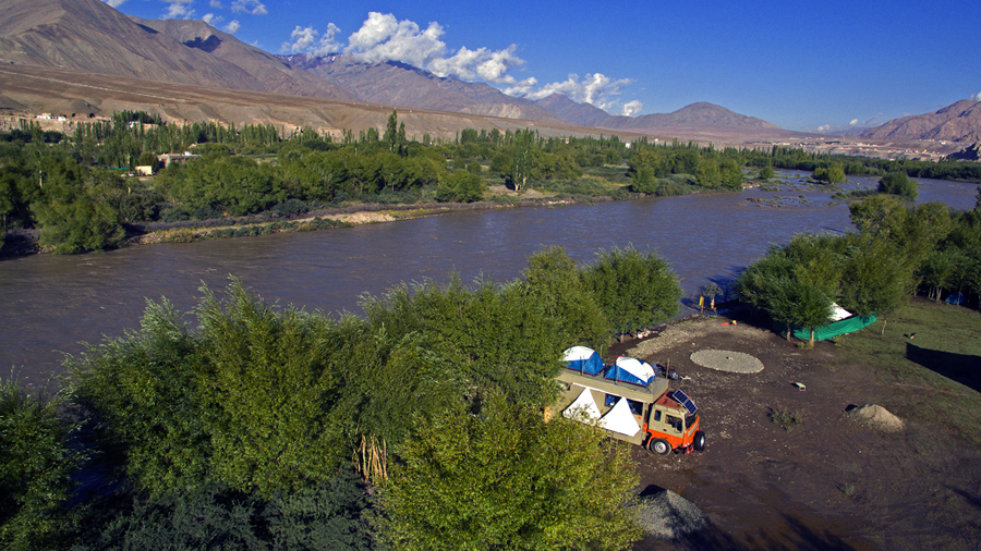 <img src="riverside camping.jpeg" alt="offbeat overlanding riverside caravan camp for family, all women groups, single girls, to relax, rejuvenate with nature, secluded quiet peaceful camp locations, best veg food">