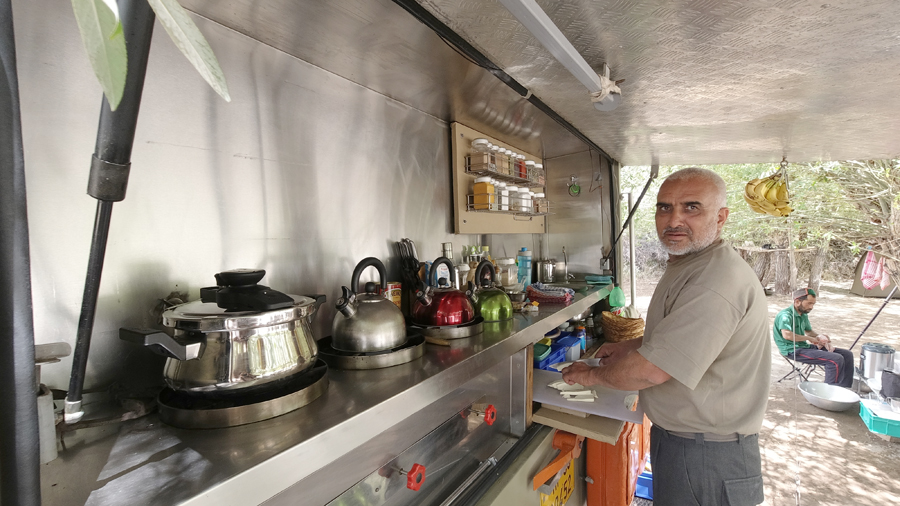 <img src="kitchen of caravan motorhomeindia.jpeg" alt="kitchen on caravan campervan vacation overlanding holiday onboard overland truck motorhome for best for family holidays in setting of rural india">