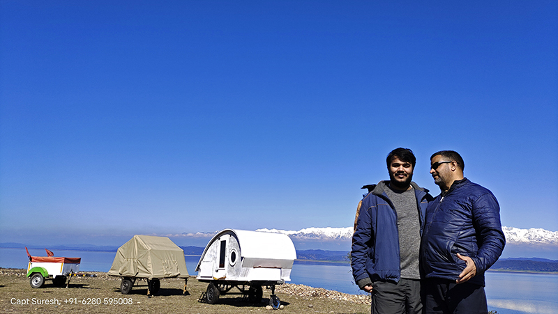 <img src="camping trailer family holidays caravan himachal.jpeg" alt="offbeat family holiday in wilderness with camping trailers caravan RV campervan motorhome nomadic unique experiential vacation pong dam himachal">